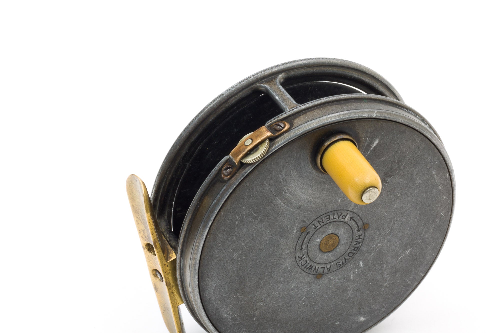A Mitre Hardy The Jewel fly fishing reel, along with a Hardy's The